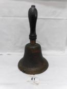 A Victorian school bell with ebonised handle