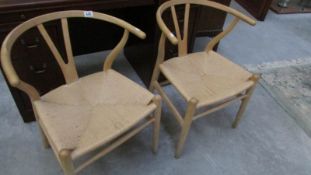 A pair of Carl Hansen Danish wishbone chairs