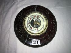 A super red Cornish Serpentine barometer with porcelain face,