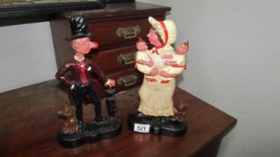 A pair of Punch and Judy door stops