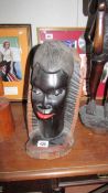 A carved wood African bust