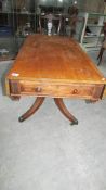 A centre pedestal mahogany Pembroke table