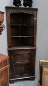 An oak corner cabinet