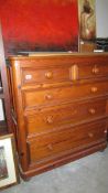 A pine 2 over 3 chest of drawers