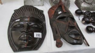 2 carved wood African masks