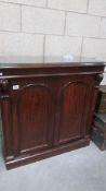 A small mahogany sideboard