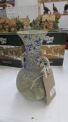 A two handled antique blue glass vase