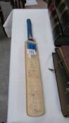 A miniature cricket bat for Retford cricket club with team signatures