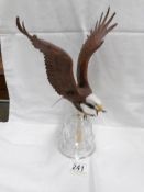 A Franklin mint porcelain eagle on crystal bell