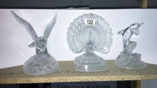A crystal eagle, peacock and dolphin by Crystal D'Arques,