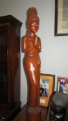 A tall carved wood oriental female figure