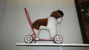 A 1960/70's push along toy dog