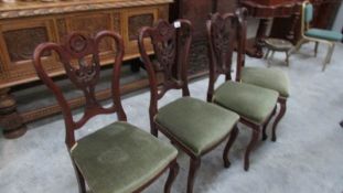 A set of 4 mahogany dining chairs