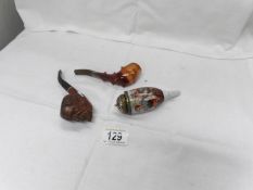 A carved wood pipe,