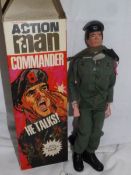 A boxed 1970 talking action man commander figure with realistic hair, papers, stickers,