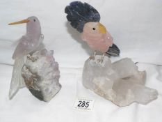 A Rose Quartz and agate parrot on a quartz base together with an amethyst bird