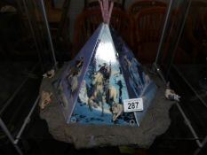 An usual ceramic Tepee comprising of 6 decorated panels,