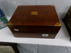 A Victorian walnut box with brass corners