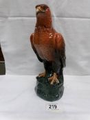 A Royal Doulton Whyte and Mackay golden eagle whisky decanter