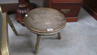 An oriental brass stool