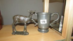 A bronze model of a deer and a pewter loving cup