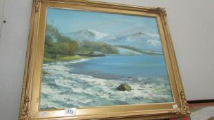 A gilt framed oil on board snow capped mountain lake scene signed Caryl Wood