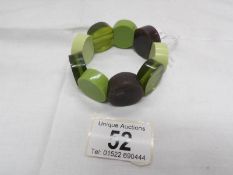 A bakelite bracelet in green tones