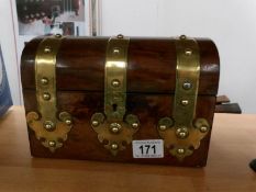 A Victorian dome top walnut brass banded tea caddy