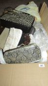 A mixed lot of linen, vintage clothing, accessories including handbags, gloves, collars,