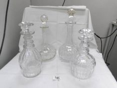 4 good quality decanters with stoppers