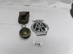 An AA badge and a leather cased compass