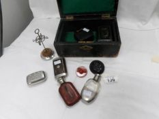 A mixed lot including miniature hip flasks, hat pin stand, pill boxes,