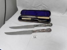 A cased carving set and 2 carving knives