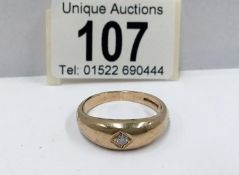 A heavy yellow gold diamond solitaire ring