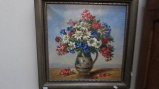 A mid 20th century oil on canvas still life of flowers in jug signed F Laurence