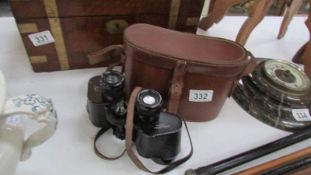 A leather cased set of 8 x 40 binoculars by Dolland,