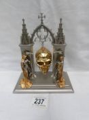 A Franklin mint Hour of Destiny collector's watch as a skull on stand