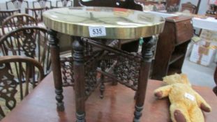 A small Indian brass top table,