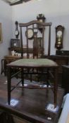 An Edwardian mahogany inlaid bedroom chair