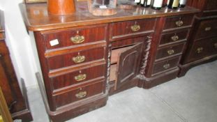 A mahogany kneehole desk