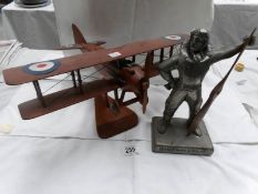 A figure of a WW1 pilot and a wooden bi-plane