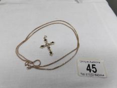 A 9ct gold cross pendant and a 9ct gold chain