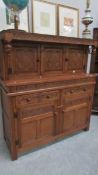 A carved oak court cupboard