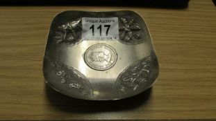 A sterling silver dish with Hong Kong dollar in centre