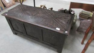 A carved blanket box