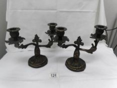 A pair of small brass candelabra