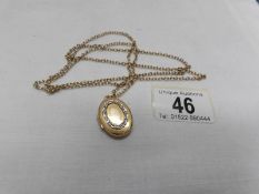 A 9ct gold locket on a 9ct gold chain