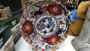 A good quality Imari charger decorated with birds and dragon,