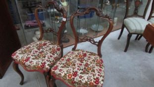 A pair of Victorian mahogany cabriole leg chairs