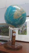 A world globe on wooden stand